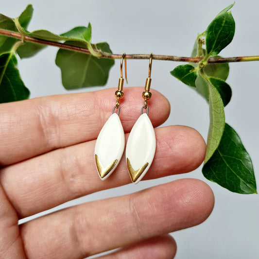 Handmade ceramic earrings with 24c gold small white leaf