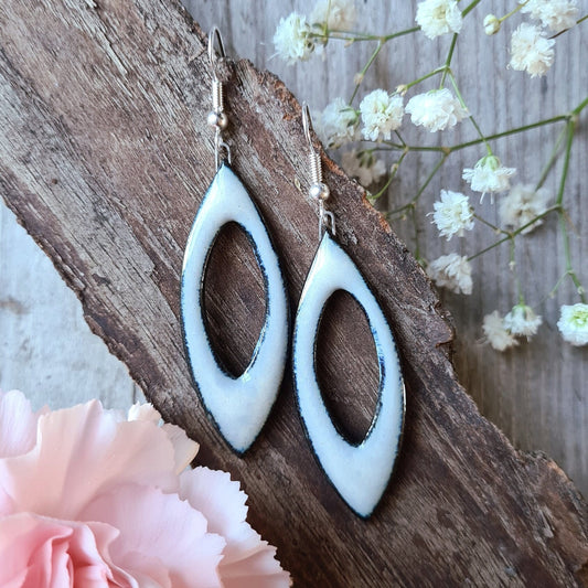 Handmade ceramic white leaf shaped dangle earrings with blue tint