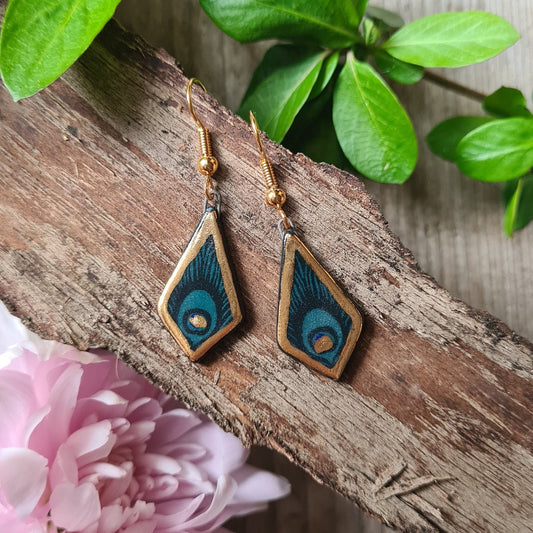 Handmade black ceramic earrings with 24c gold and peacock feather detail