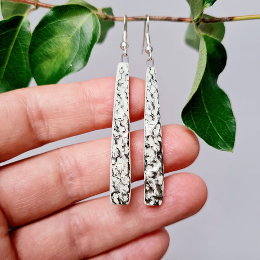 Handmade ceramic earrings with dappled platinum