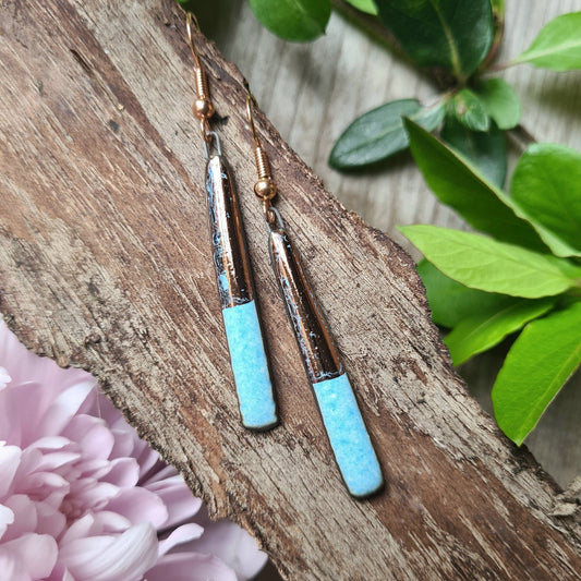 Handmade ceramic earrings with copper luster on black clay