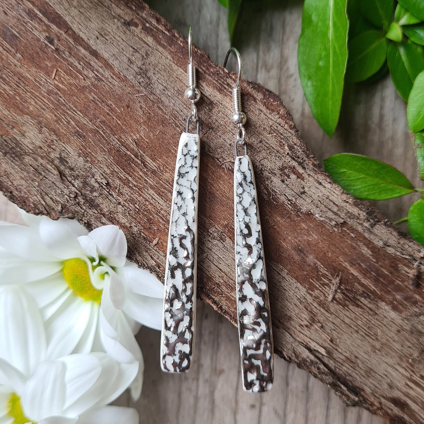 Handmade ceramic earrings with dappled platinum